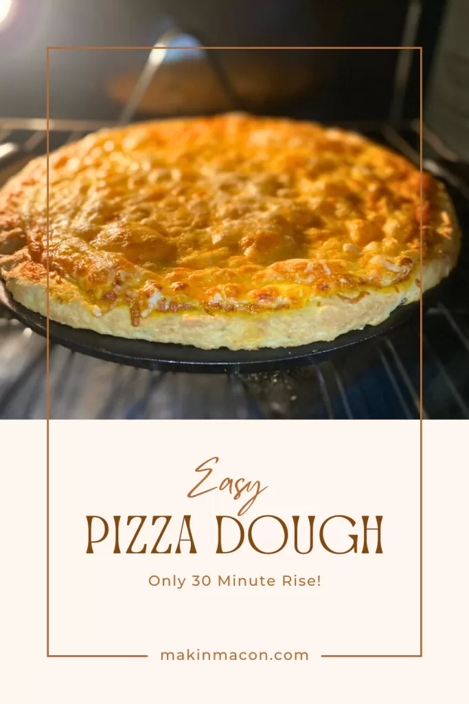 Quick pizza dough baked on a cast iron pan, topped with melted cheese and ready in 30 minutes.