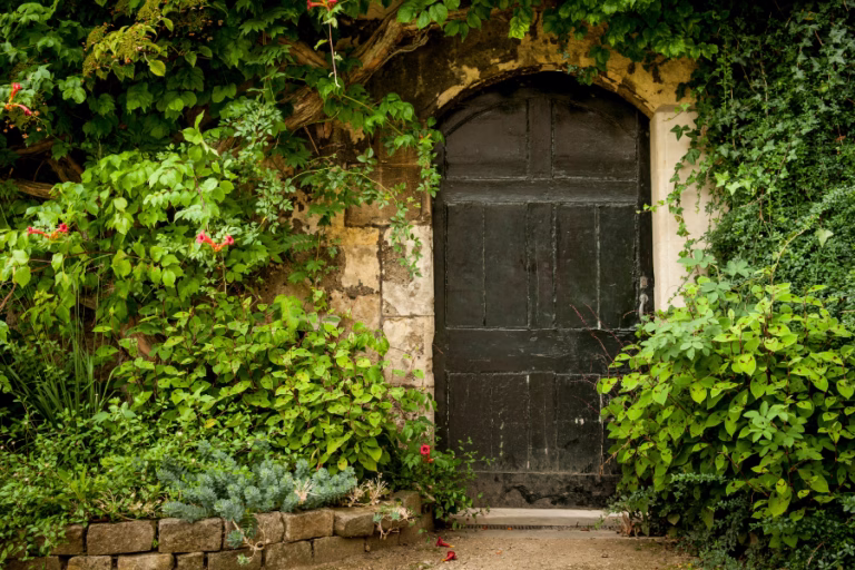 A peaceful garden doorway representing a quiet place of prayer and time with God