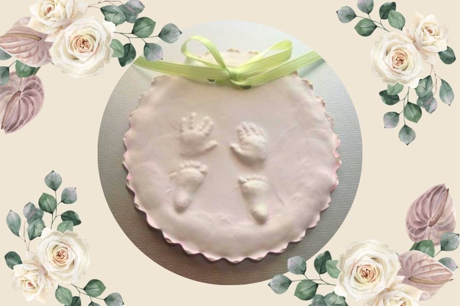 Clay imprint of baby hands and feet with a green ribbon, symbolizing the ache of unanswered prayers and silent hope.