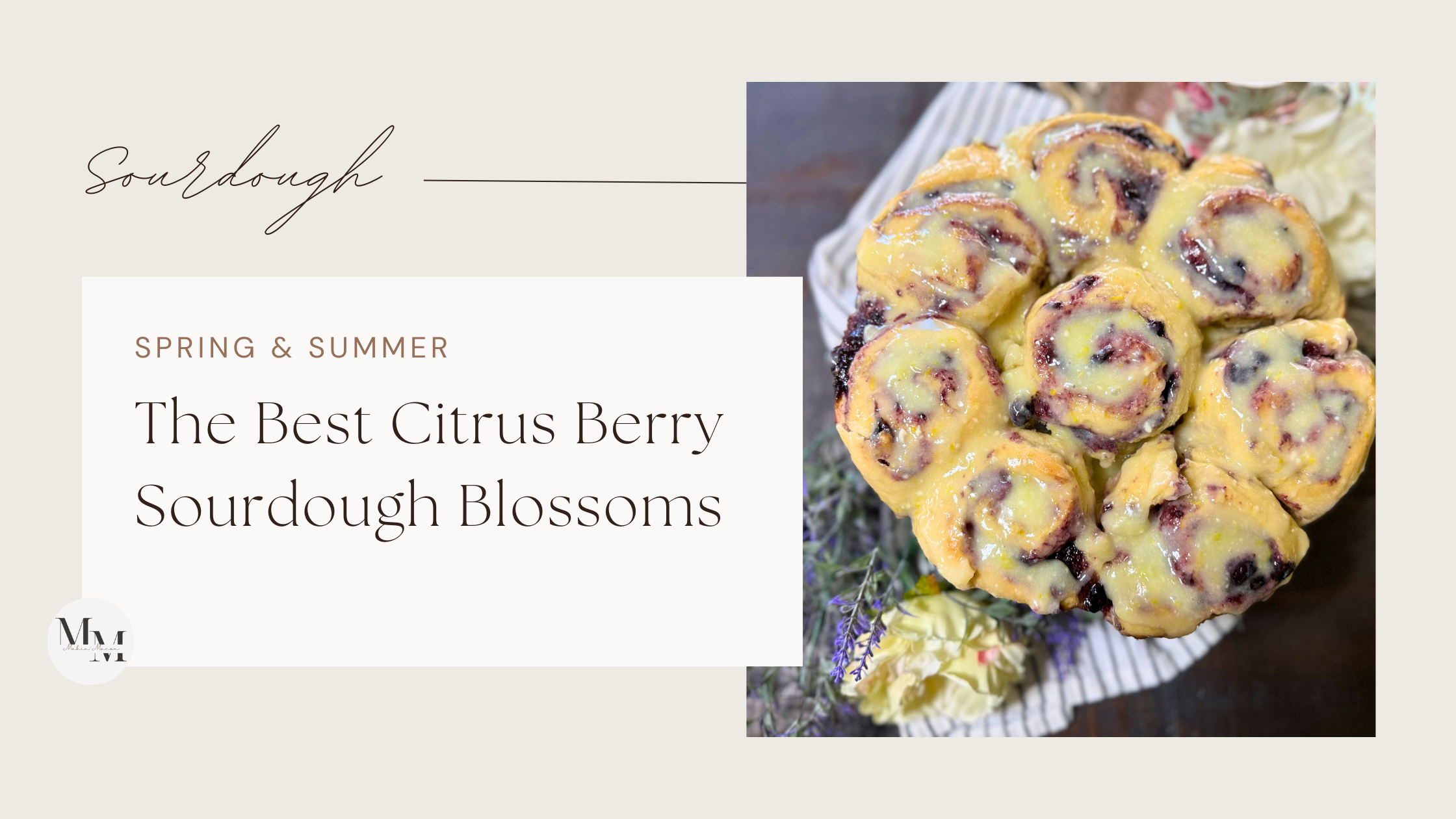 Overhead view of glazed citrus berry sourdough blossoms arranged in a flower shape on a plate with fresh flowers beside them.