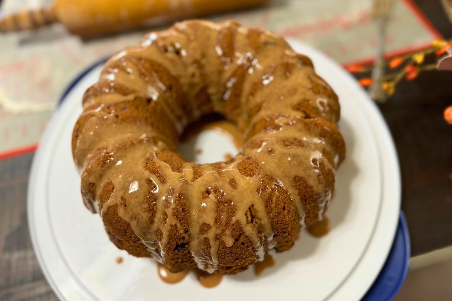 Sourdough pumpkin bundt cake with glaze on a plate, moist and homemade dessert