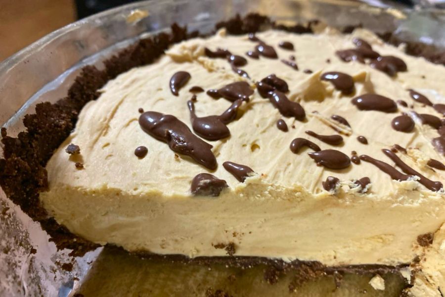 Keto peanut butter pie with chocolate drizzle in a crust, no bake dessert