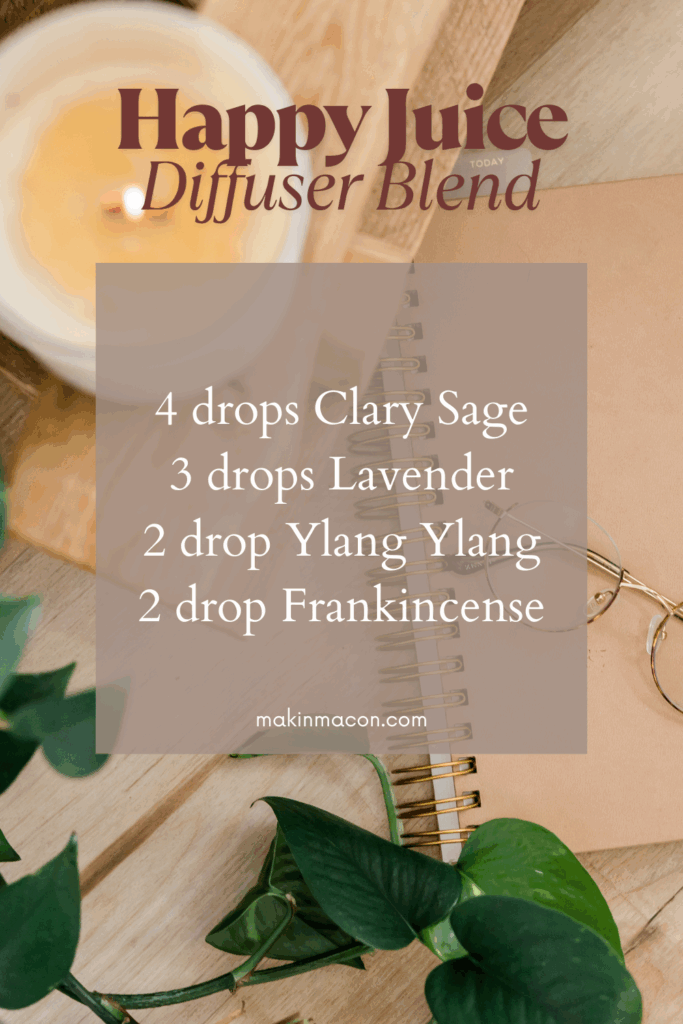 Happy Juice essential oil diffuser blend recipe graphic with clary sage, lavender, ylang ylang, and frankincense on a cozy desktop background