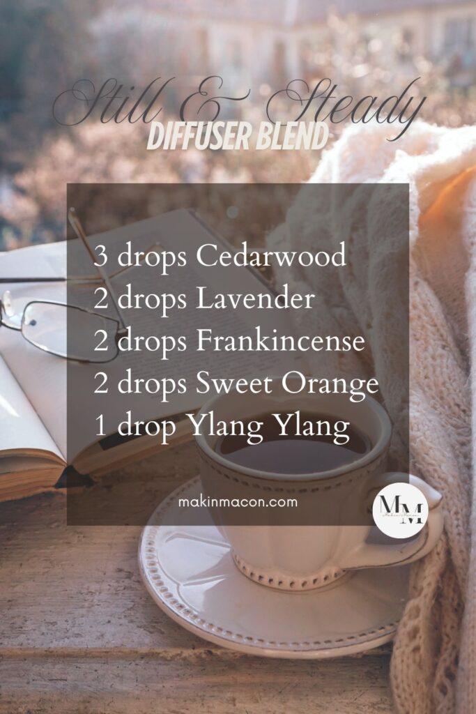 Still & Steady diffuser blend recipe card with peaceful Bible study setting, essential oil drops listed over a cozy background with tea and open book.