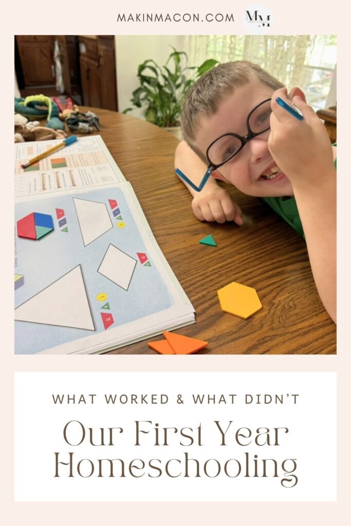 Smiling homeschool student at the table during our first year homeschooling with curriculum and math tools