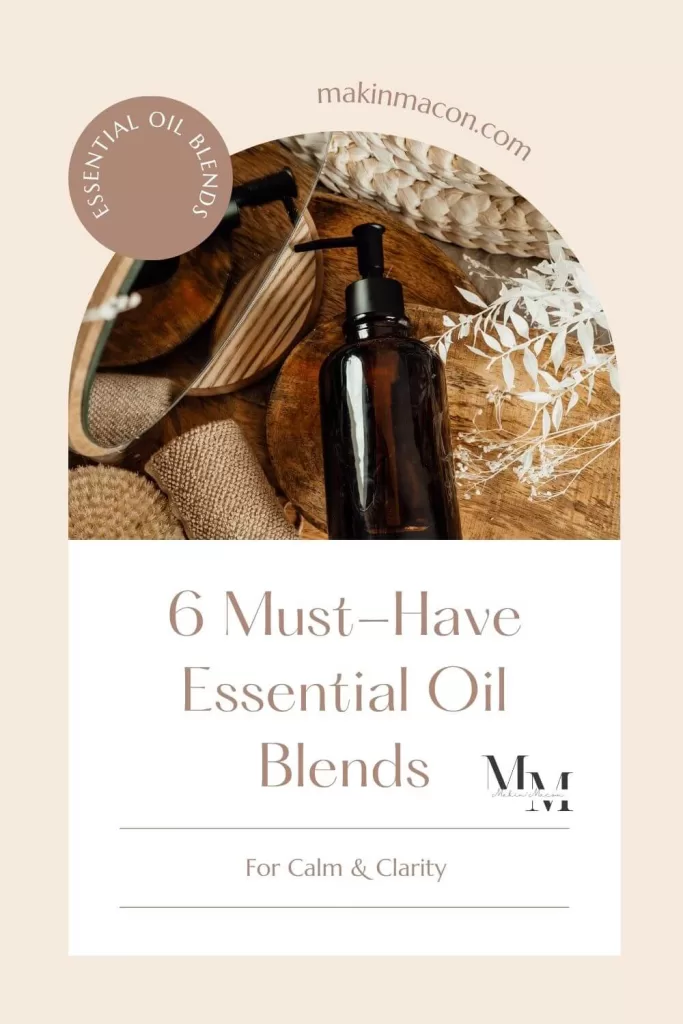 Amber essential oil bottle on wooden boards with natural textures and neutral tones, labeled “6 Must-Have Essential Oil Blends for Calm and Clarity.”