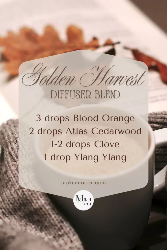 Golden Harvest diffuser blend recipe with blood orange, cedarwood, clove, and ylang ylang on a cozy fall background.
