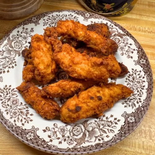 • These homemade chicken strips have a light, golden coating that is crisp on the outside and tender inside. • The marinade is generous and can coat up to 5 chicken breasts, but if cooking more than 3 breasts, you may need to increase the flour coating mixture. • Oil temperature can vary depending on your stove and thermometer. If the coating browns too quickly, reduce heat slightly before continuing. • Chicken can be cut into traditional strips or nugget-size pieces.
