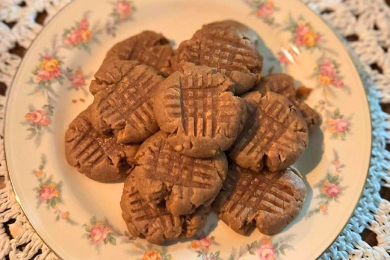 Keto peanut butter cookies on a floral plate, soft and chewy homemade low carb dessert