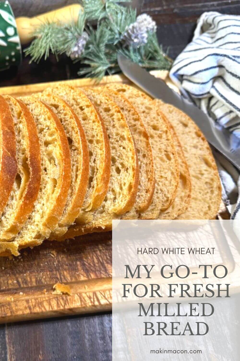 Hard white wheat fresh milled bread sliced on cutting board with text overlay my go-to for fresh milled bread
