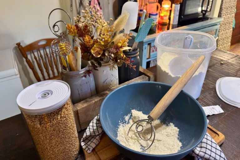Fresh milled flour and hard white wheat berries prepared for homemade bread baking in a busy family kitchen